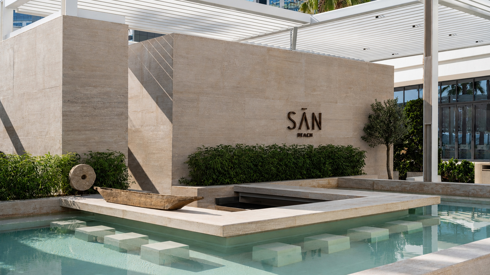 SĀN Beach Palm Jumeirah beach club fit-out and MEP works featuring luxury beachfront dining, infinity pool, marble archways, open kitchen, premium cabanas, and contemporary hospitality interiors | Beachfront Dining | Photo by Natelee Cocks
