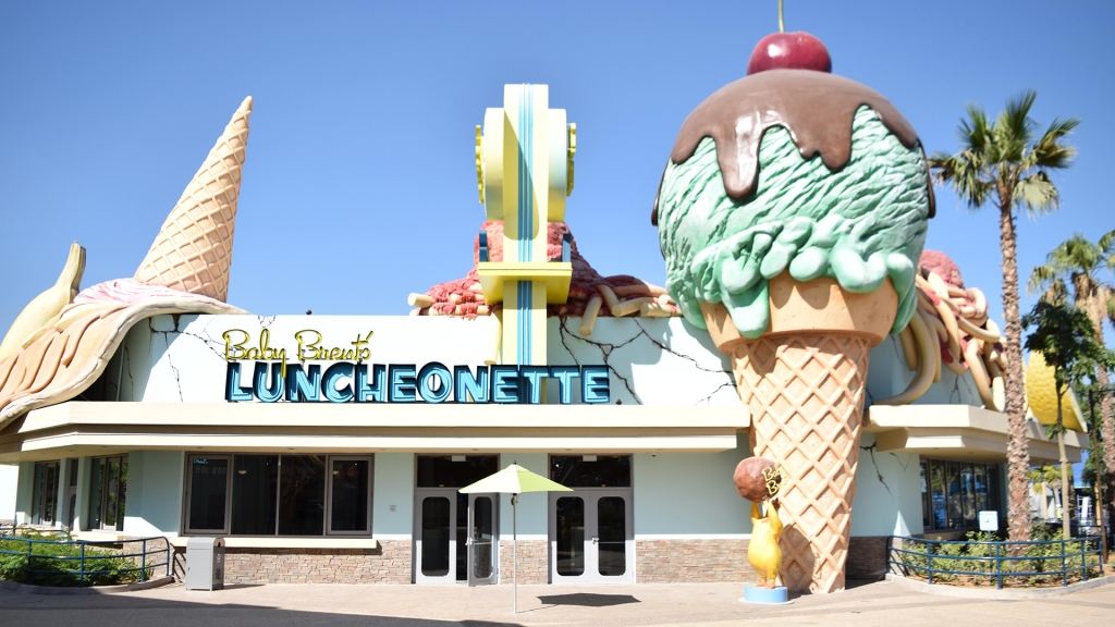 Motiongate Dubai themed restaurant featuring immersive Hollywood-inspired theming, oversized ice cream sculptures, custom façades, and themed interior fit-out by ARCO