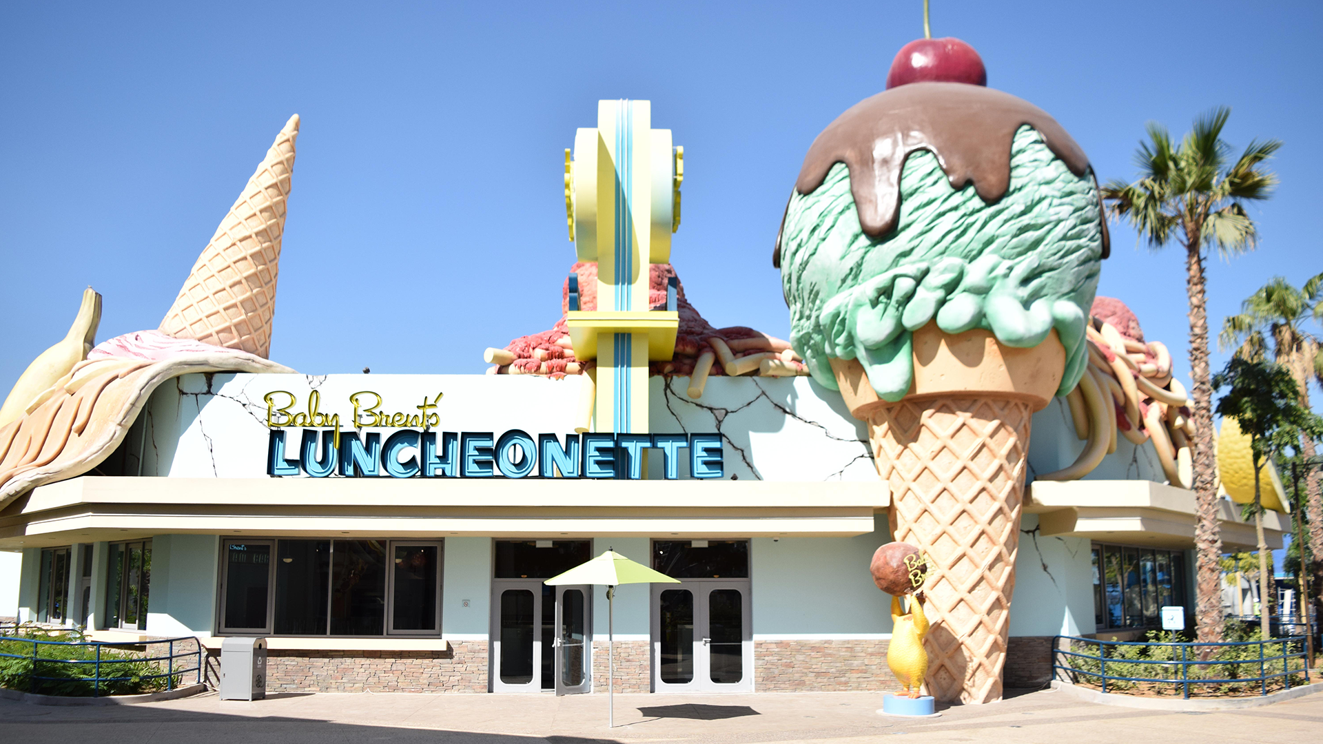 Motiongate Dubai themed restaurant featuring immersive Hollywood-inspired theming, oversized ice cream sculptures, custom façades, and themed interior fit-out by ARCO